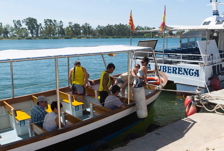 tourists climbing the Ebro Delta boats