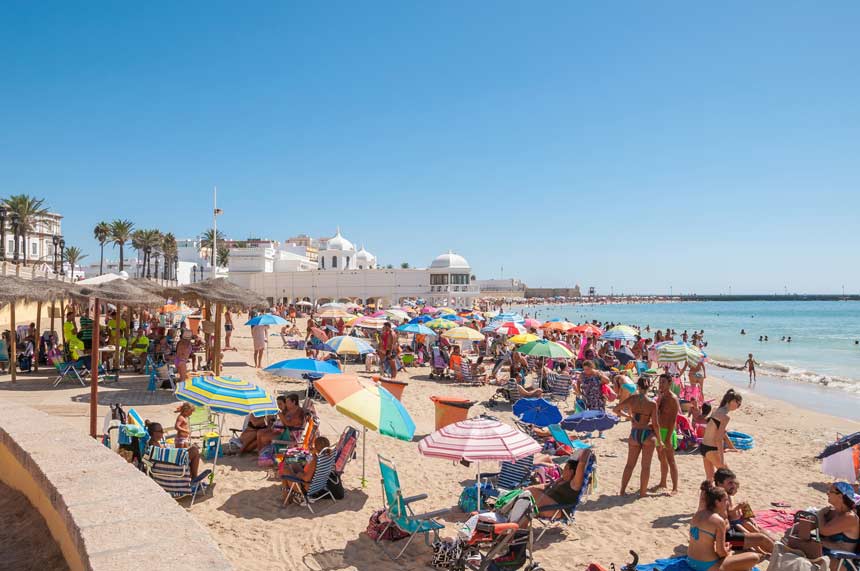People on the beach La Caleta in Cadiz