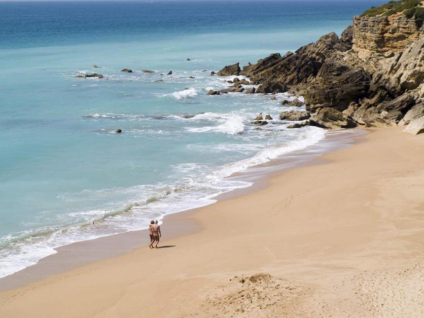 People walking in Playa-de-Roche-beach-in-Conil-de-Frontera